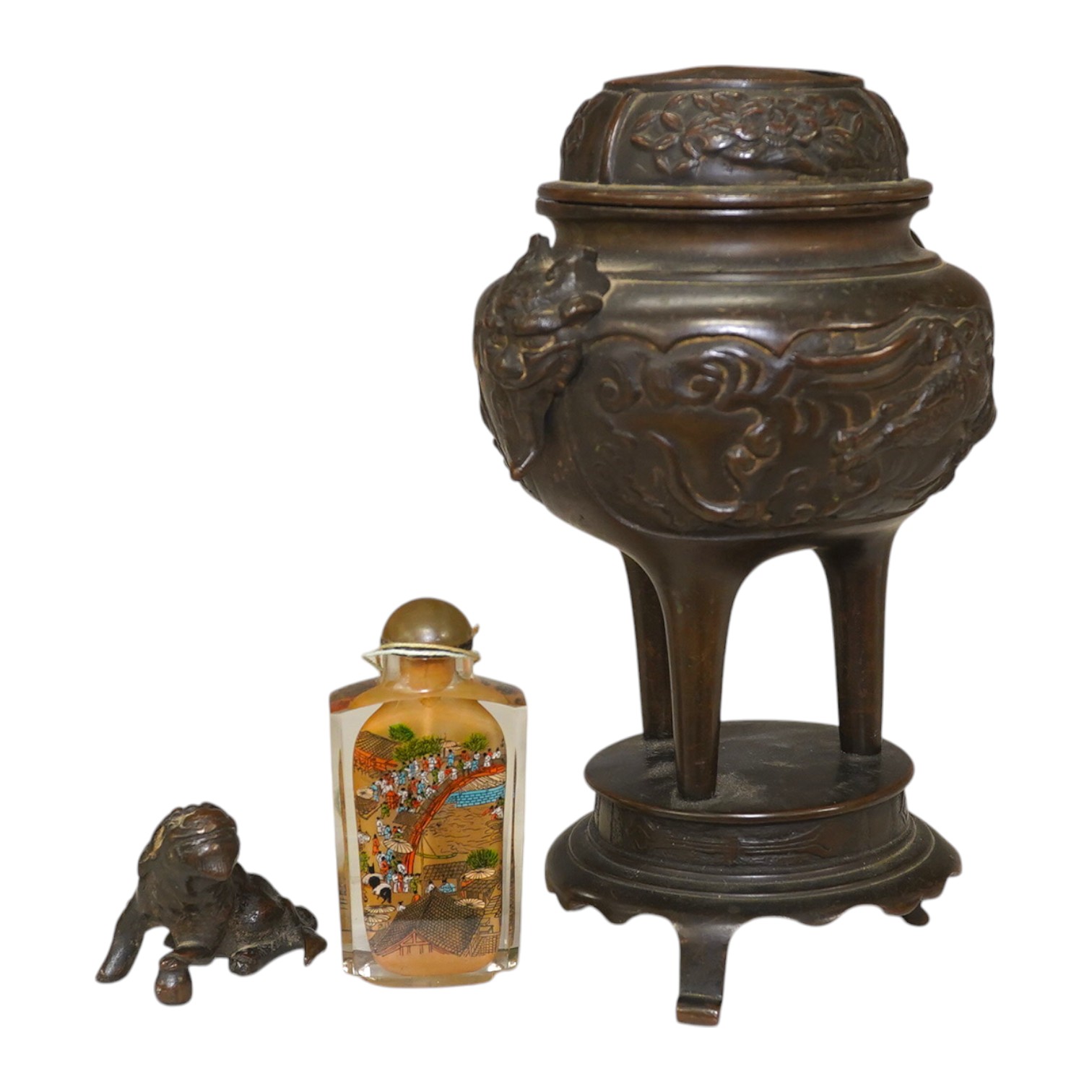 A Japanese bronze koro and cover, 23.5cm high, together with a inside painted glass snuff bottle, 8.5cm high. Condition - fair, dog detached from cover of koro, etc.